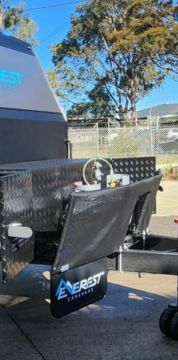 Heavy-duty D-Flector mudflap detail on an Everest Caravan